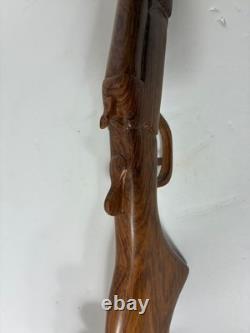 Wood carved single barrel shotgun approximately 40 inches long