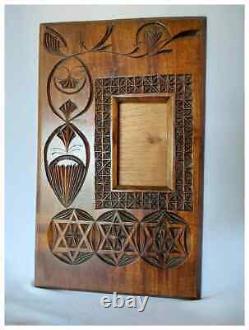Cadre de miroir en bois sculpté en éclats d'art populaire antique