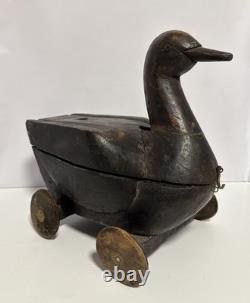 Canard en bois sculpté à la main antique sur roues, art populaire avec compartiment secret/Lire