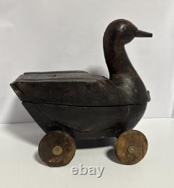 Canard en bois sculpté à la main antique sur roues, art populaire avec compartiment secret/Lire