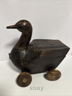 Canard en bois sculpté à la main antique sur roues, art populaire avec compartiment secret/Lire
