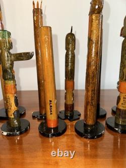 Collection de Totems Anciens en Bois Sculpté et Peints à la Main - Une Folklore Étonnante