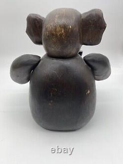Grand éléphant sculpté à la main dans le style de l'art populaire articulé