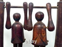 Jouet de trapèze pour enfants en art populaire américain, sculpté à la main et ancien