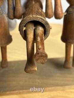 Jouet de trapèze pour enfants en art populaire américain, sculpté à la main et ancien