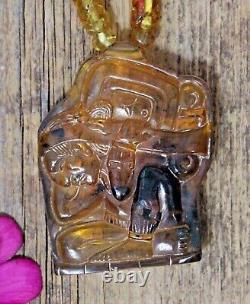 Le fardeau du temps Collier maya en ambre doré sculpté à la main Chiapas Art populaire mexicain