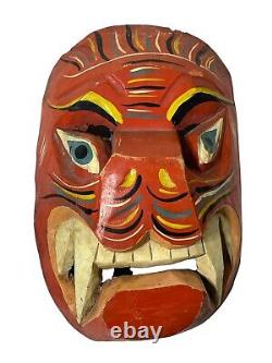 Masque en bois sculpté à la main, ancien et antique, art populaire mexicain sud-américain.