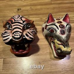 Masques de jaguar et de loup sculptés en art populaire mexicain