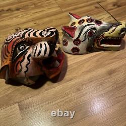 Masques de jaguar et de loup sculptés en art populaire mexicain
