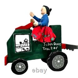 Sculpture en bois d'art populaire navajo de Delbert Buck - Femme et tracteur John Deere - Signé