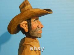 Sculpture sur bois de cowboy, caricature de l'Ouest américain, originale de 1983 par Claude Bolton